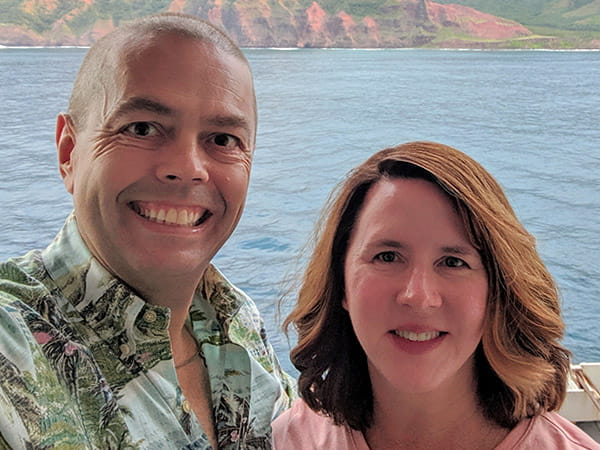 A selfie of Sheila Beal and her husband with the ocean and island mountains in the background. (©Andy Beal)