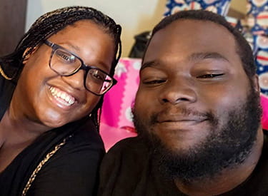 Stroke survivor, Daniel Ganier, and his wife, Denisha, smiling