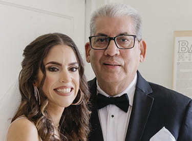 A wedding portrait of stroke survivor, Manuel Vera, and his daughter