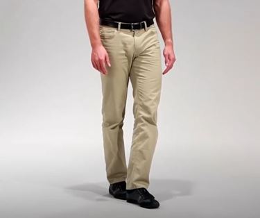 A person is standing with their left foot positioned directly in front of their right foot.