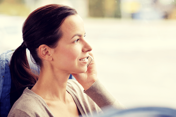 happy woman calling on smartphone